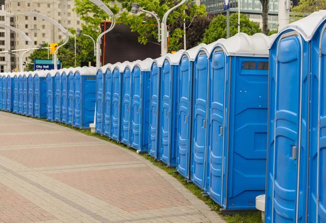 a row of portable restrooms at a fairground, offering visitors a clean and hassle-free experience in pharr